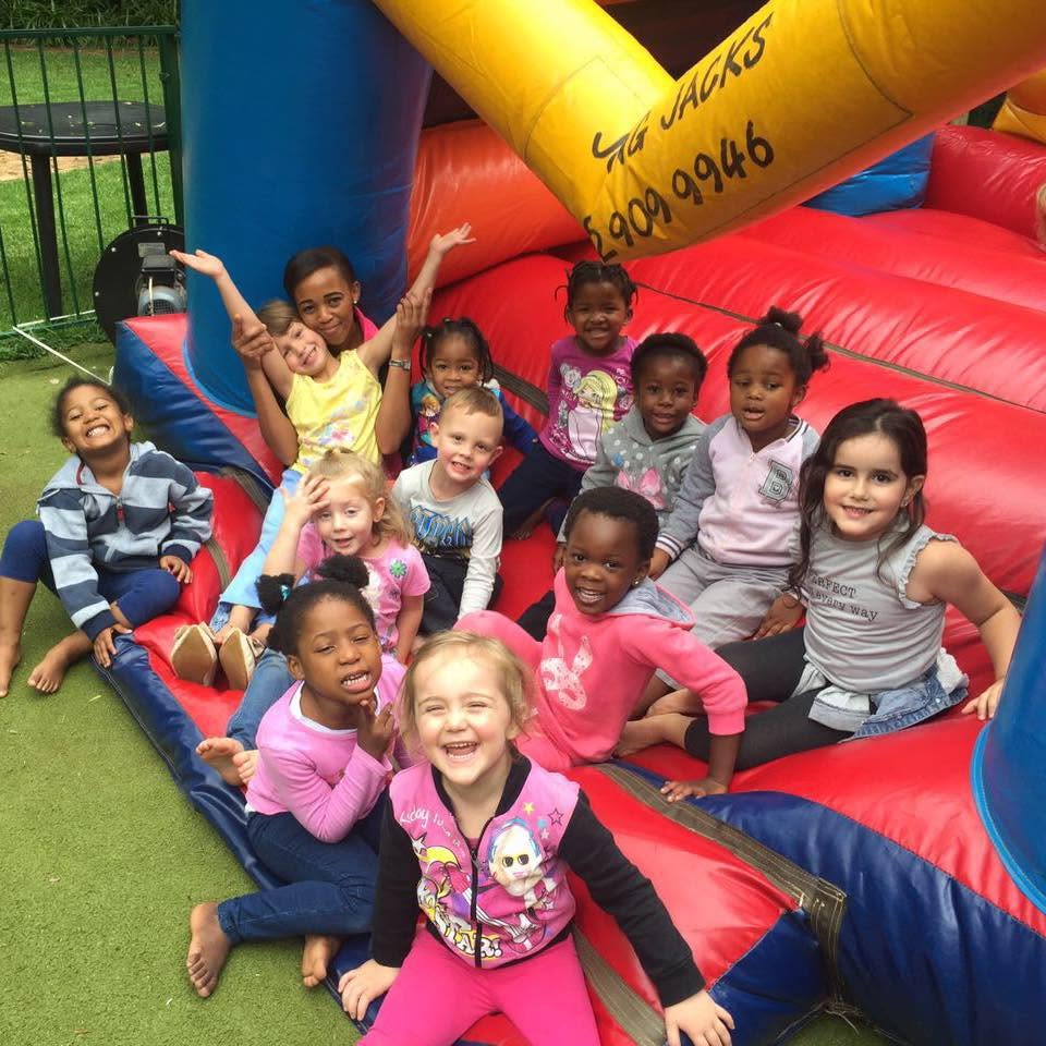 Children playing in the jumping castle at Cliffview Pines Nursery School in Fairland.